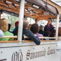 Tourists ride on a trolley in Savannah